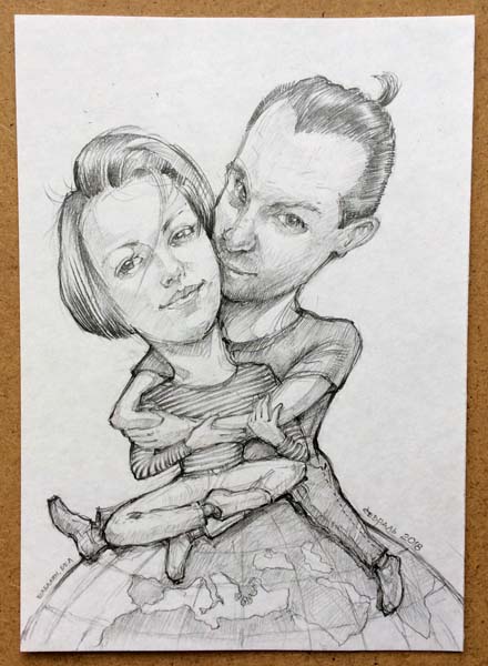 Парень обнимает девушку на Земном шаре